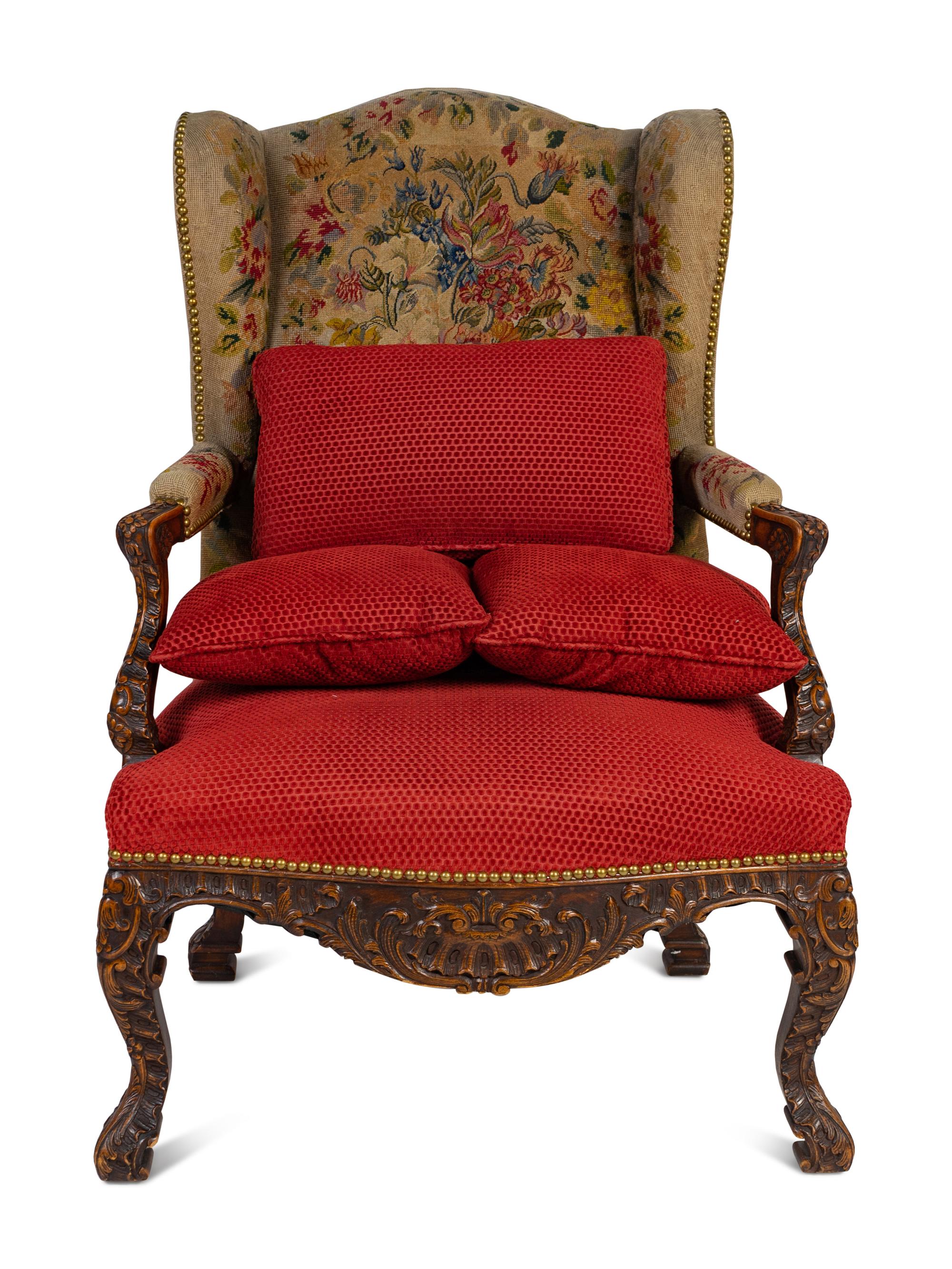 A Régence Style Carved Walnut Bergère à Oreilles with Petit Point Upholstery