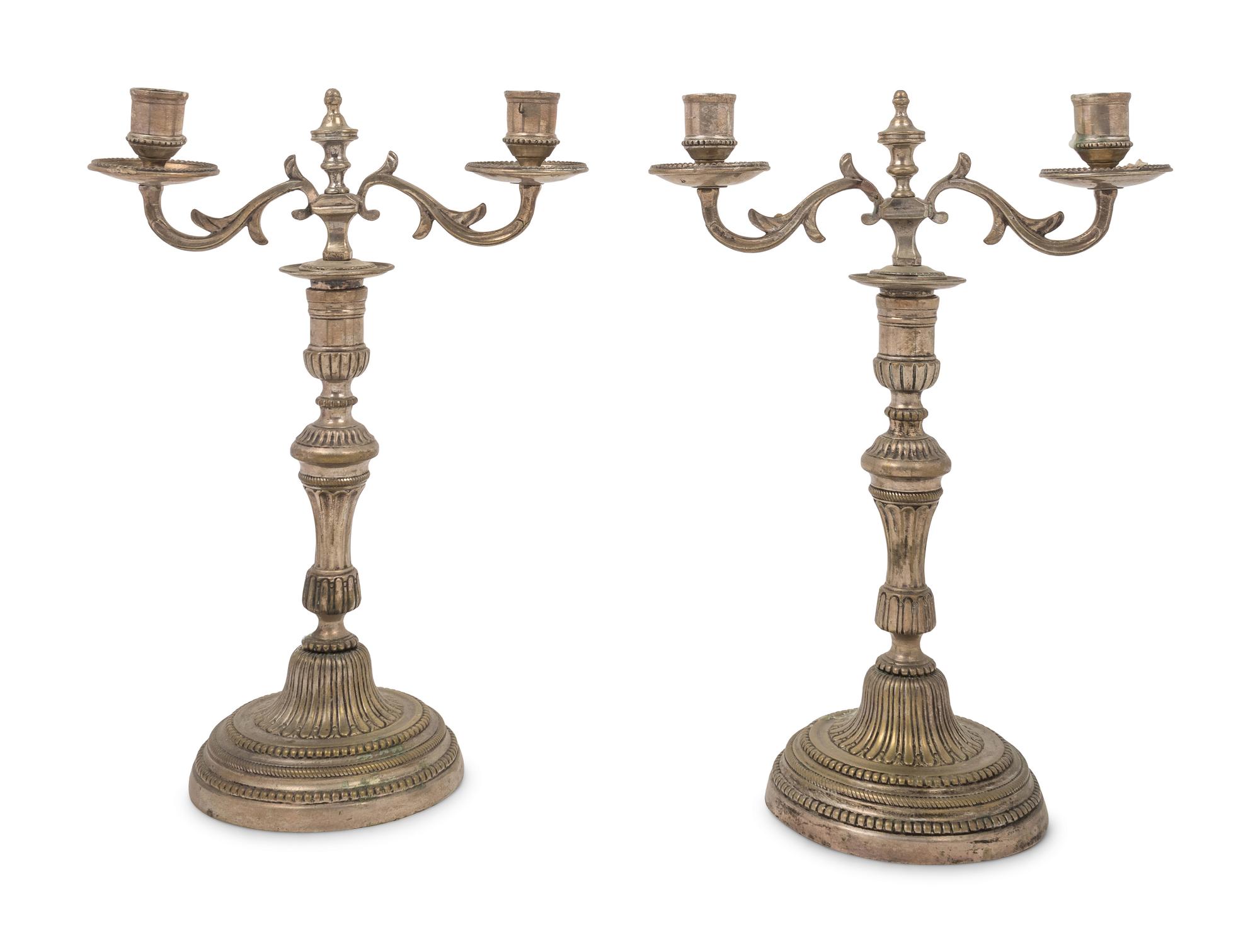 A Pair of Silvered Brass Two-Light Candelabra