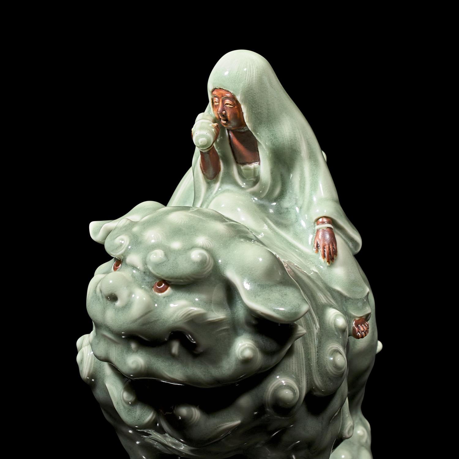 A Japanese Celadon-Glazed Monju on Lion, Impressed Seal Makuzu