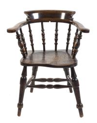 An English Yew Wood Captain's Chair Height 32 1/2 inches.