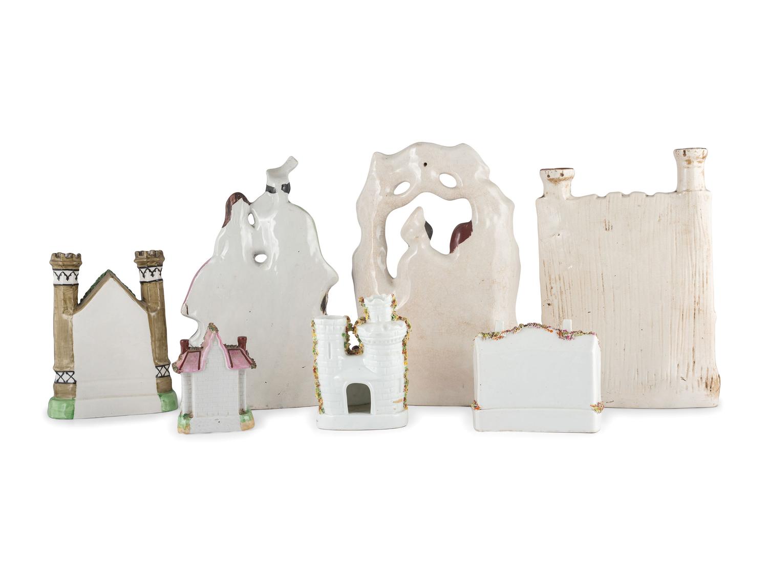 Seven Staffordshire Glazed Earthenware Buildings and Figural Groups
