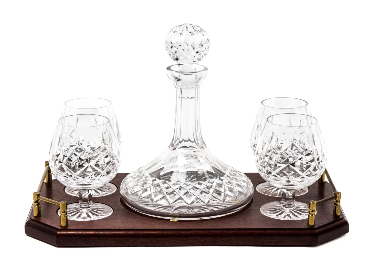 A Waterford Cut Glass Brandy Decanter and Four Snifters Height of decanter 10 inches. — 20TH CENTURY