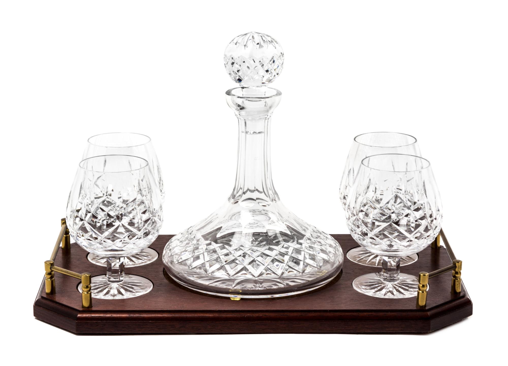 A Waterford Cut Glass Brandy Decanter and Four Snifters Height of decanter 10 inches. — 20TH CENTURY