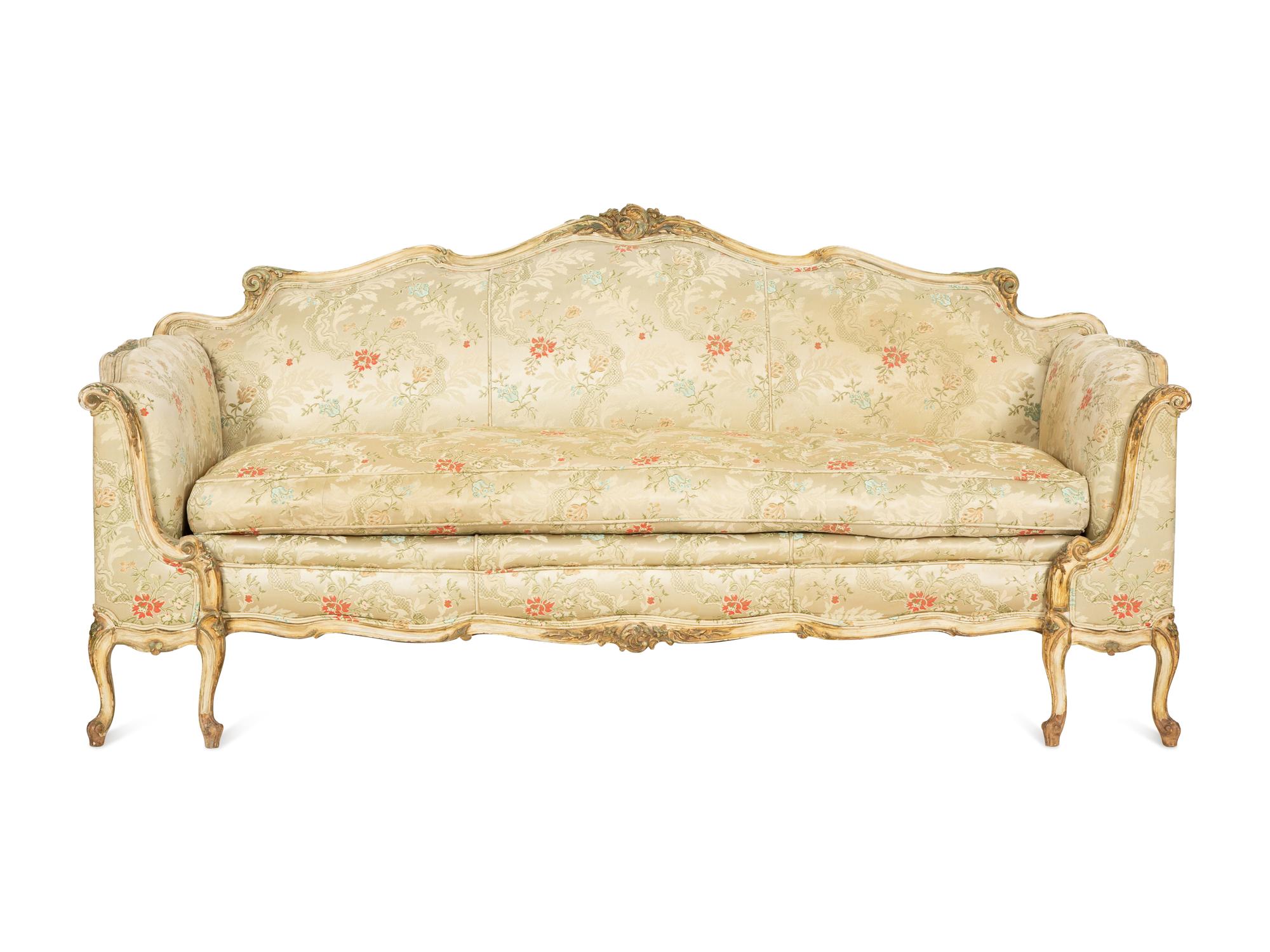 A Louis XV Style Painted and Parcel Gilt Sofa
