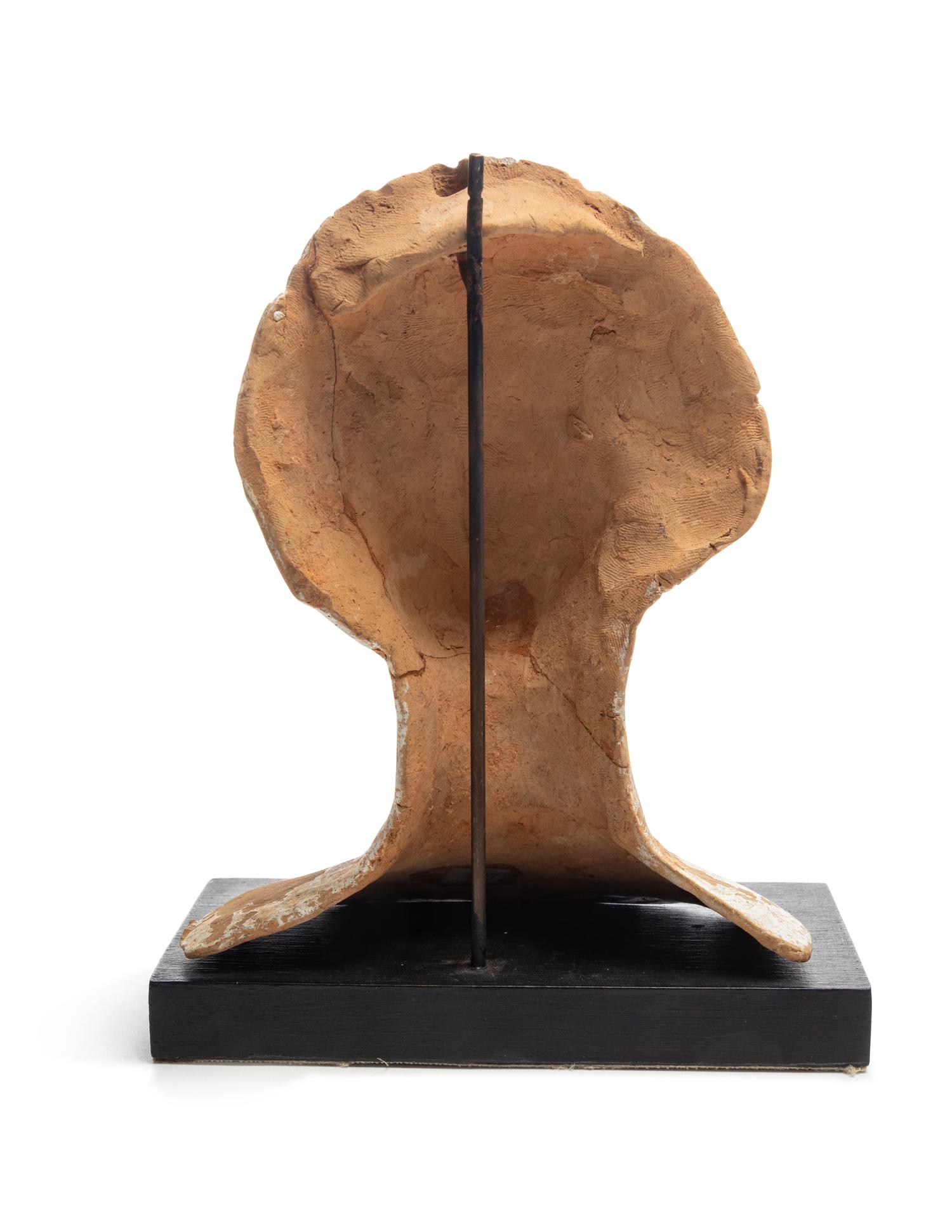 A Greek or Etruscan Terra Cotta Votive Head of a Woman