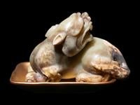 A Chinese Celadon Jade Figure of a Recumbent Bixie