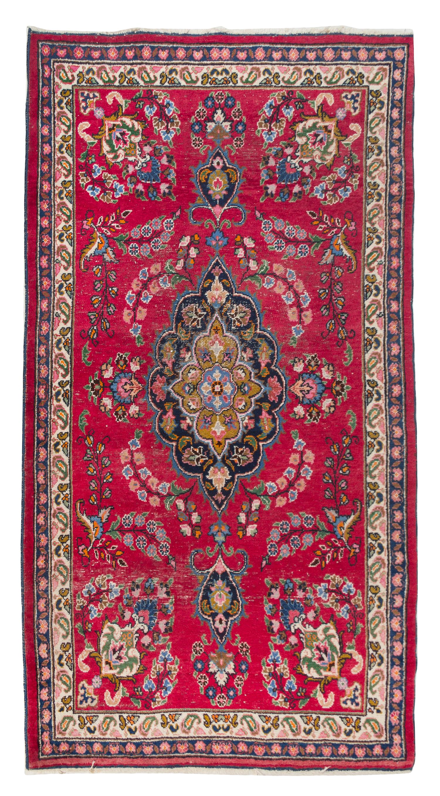A Tabriz Wool Rug 6 feet 9 1/2 inches x 4 feet 1 1/4 inches.