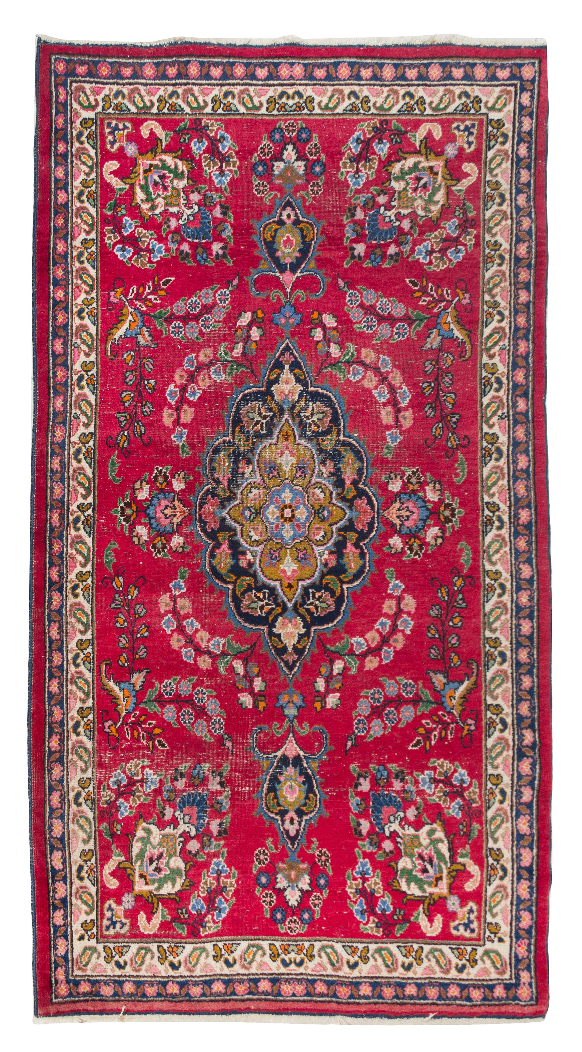 A Tabriz Wool Rug 6 feet 9 1/2 inches x 4 feet 1 1/4 inches.