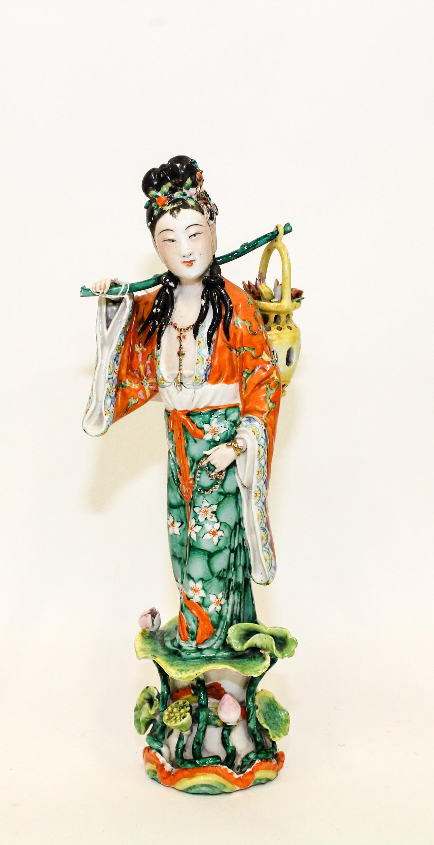 A Chinese Famille Rose Porcelain Figure Height 13 1/4 inches. — 20TH CENTURY