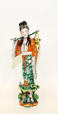 A Chinese Famille Rose Porcelain Figure Height 13 1/4 inches. — 20TH CENTURY