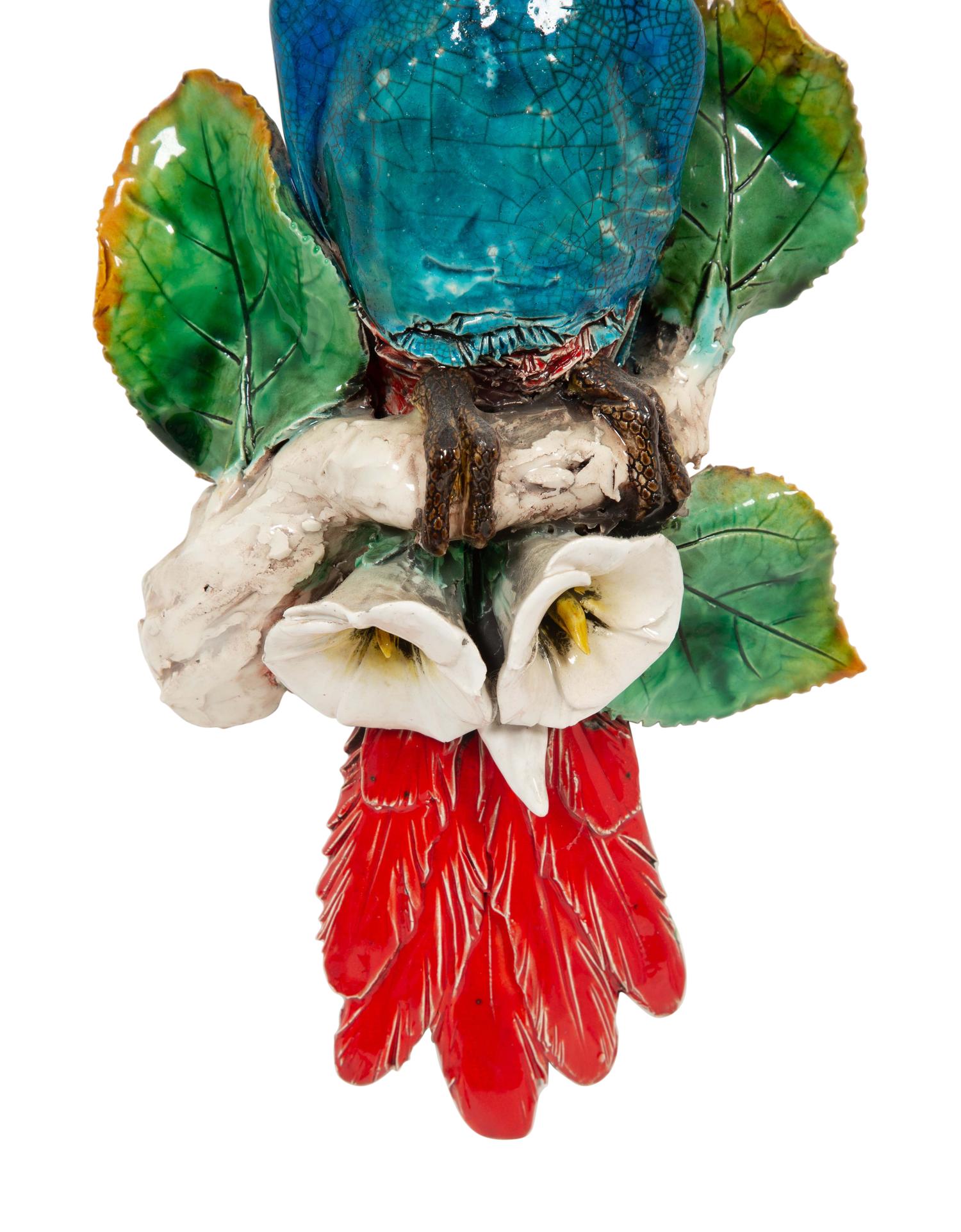 A Pair of Polychrome Glazed Earthenware Parrot Wall Appliqués