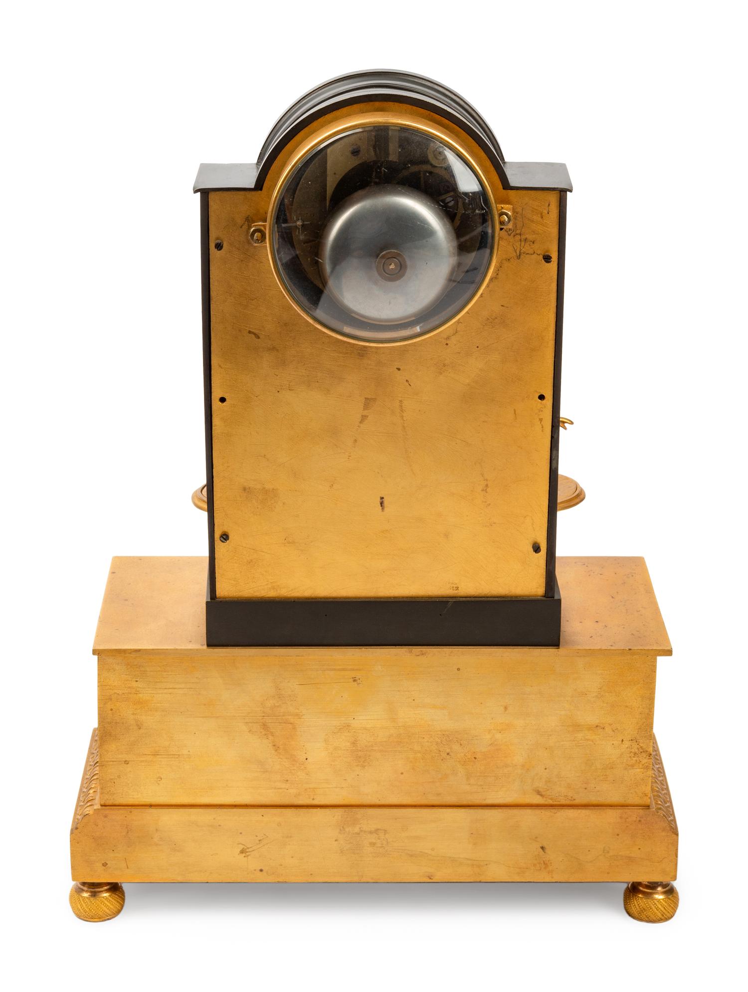 A Louis Philippe Gilt and Patinated Bronze Mantel Clock