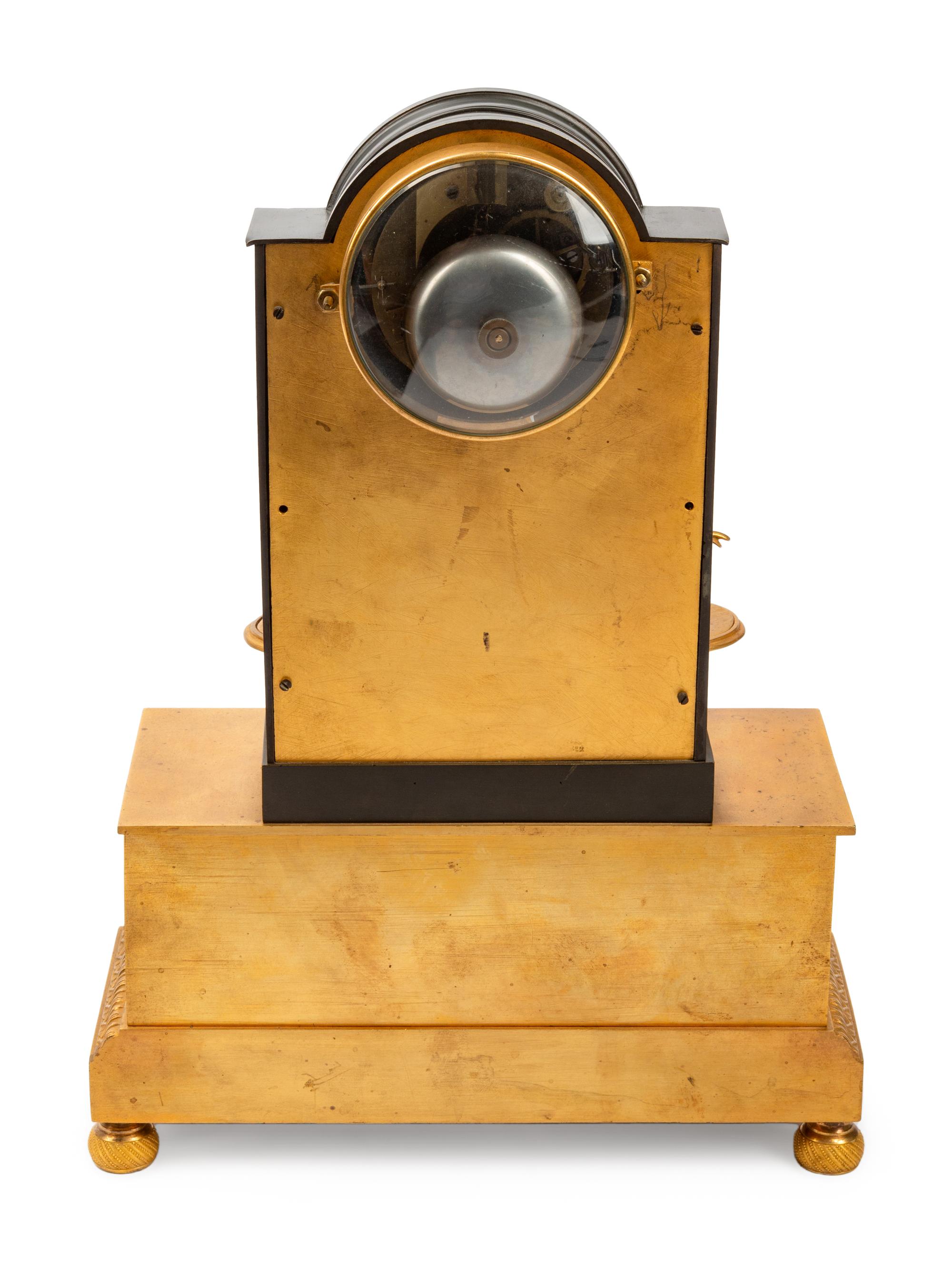 A Louis Philippe Gilt and Patinated Bronze Mantel Clock
