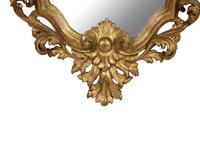 An Italian Rococo Style Giltwood Mirror