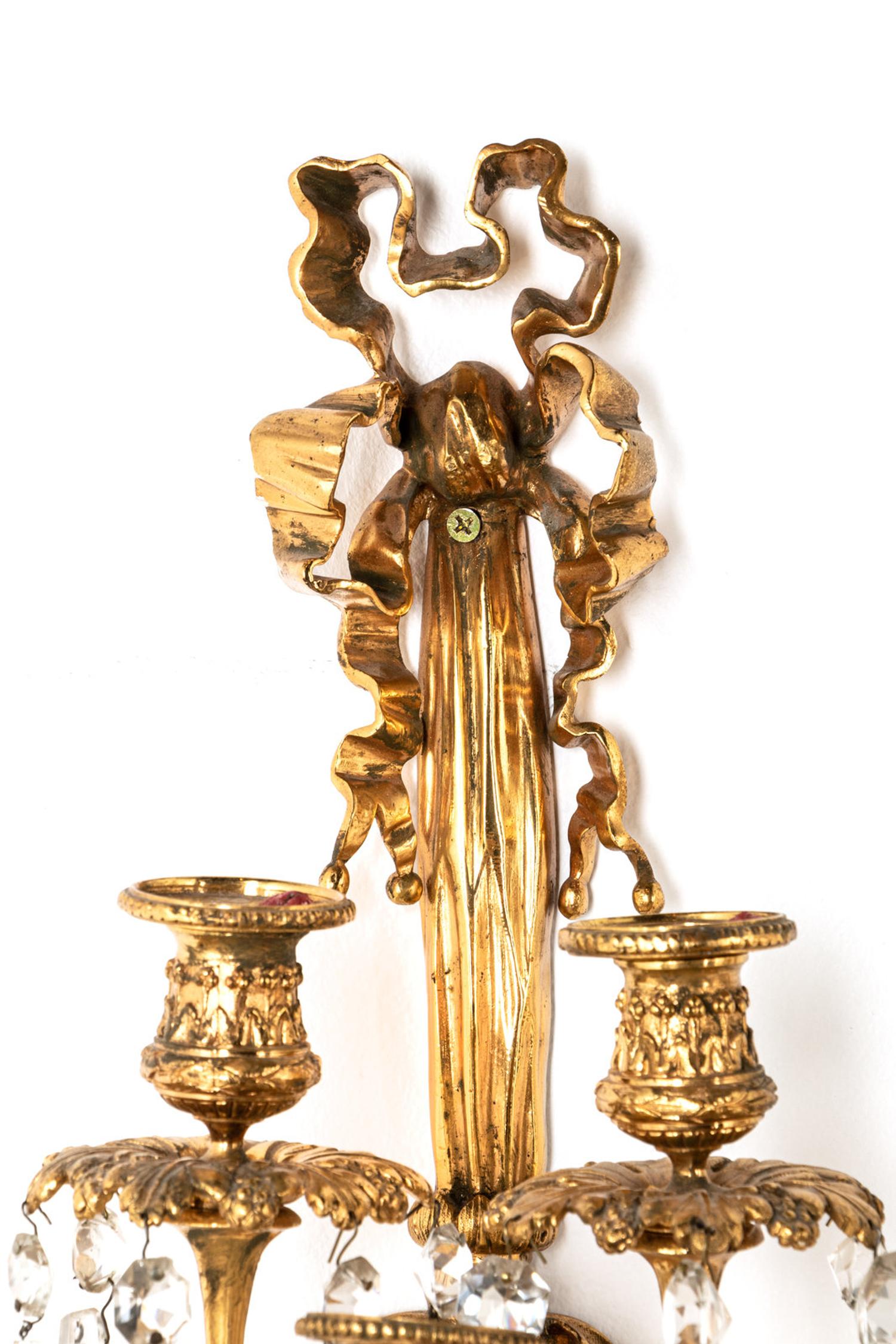 A Pair of Louis XVI Style Gilt Bronze and Cut Glass Nine-Light Sconces