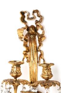 A Pair of Louis XVI Style Gilt Bronze and Cut Glass Nine-Light Sconces