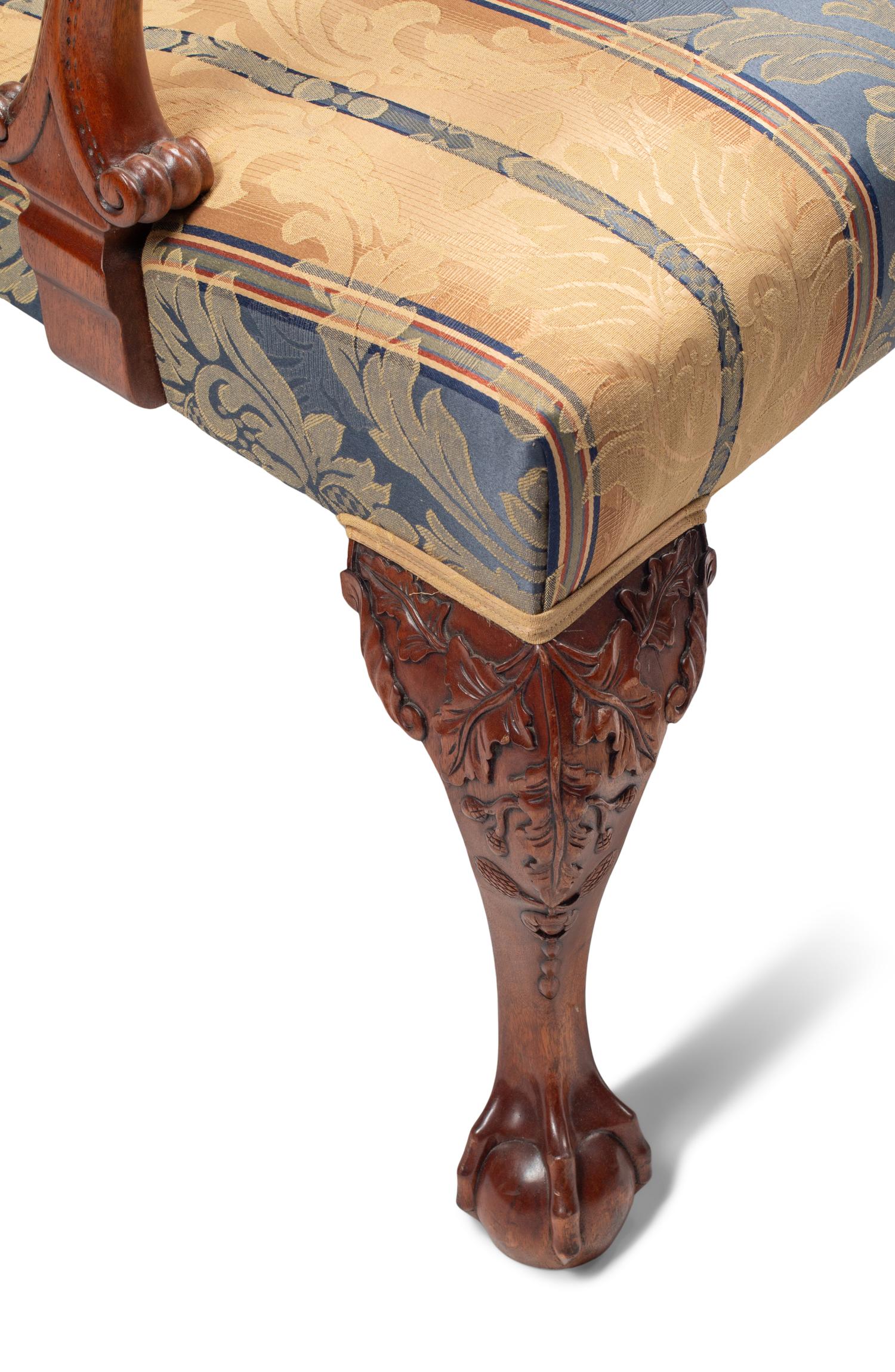 A Set of Eight George III Style Carved Mahogany Dining Chairs