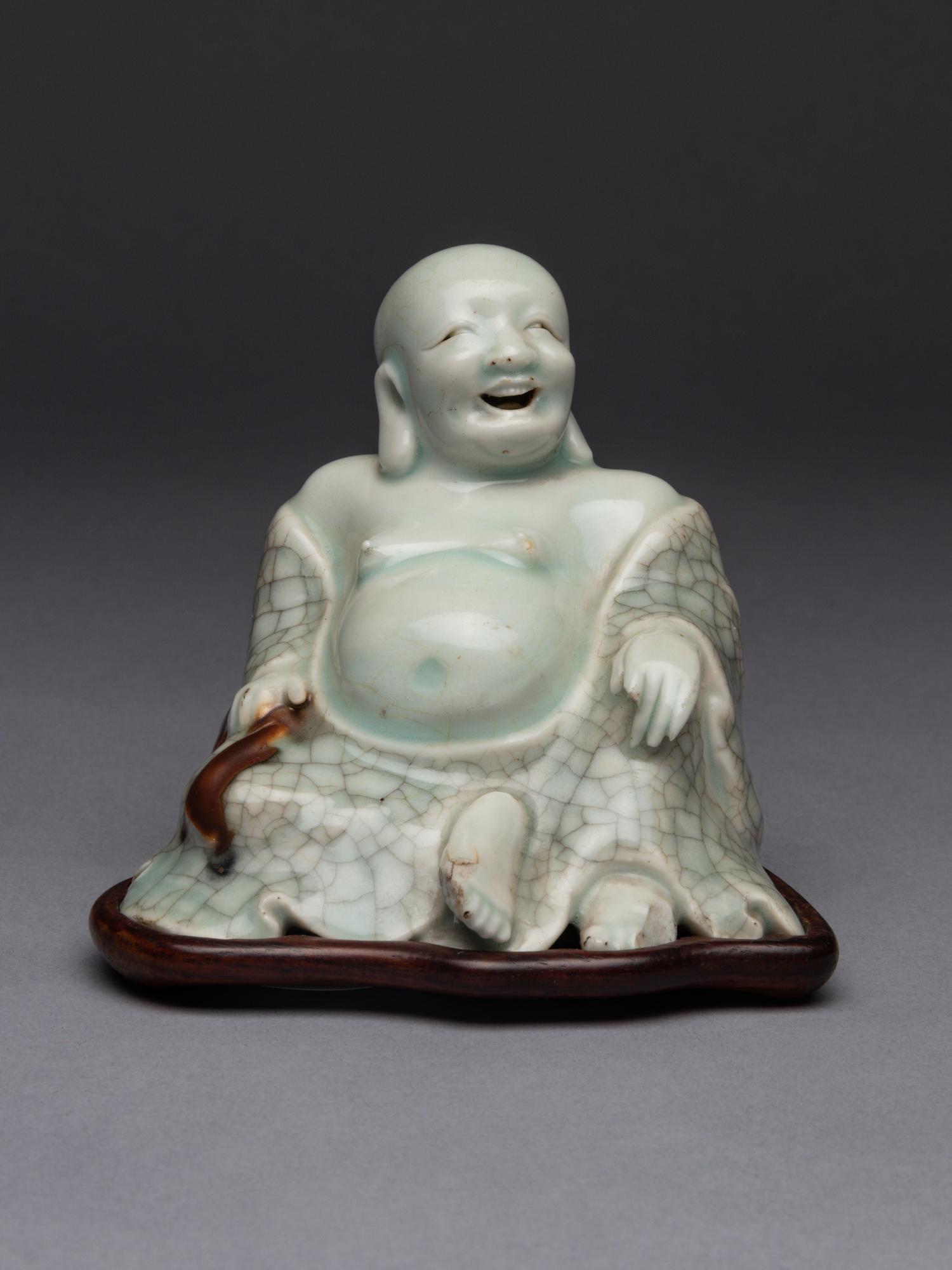 A Qingbai Glazed Porcelain Figure of Budhai Buddha