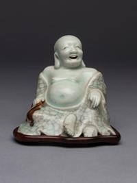 A Qingbai Glazed Porcelain Figure of Budhai Buddha