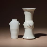 Two Chinese Blanc-de-Chine Porcelain Vases, 17th-18th Century — 清中期 德化白瓷雙輔首耳筒瓶及花觚