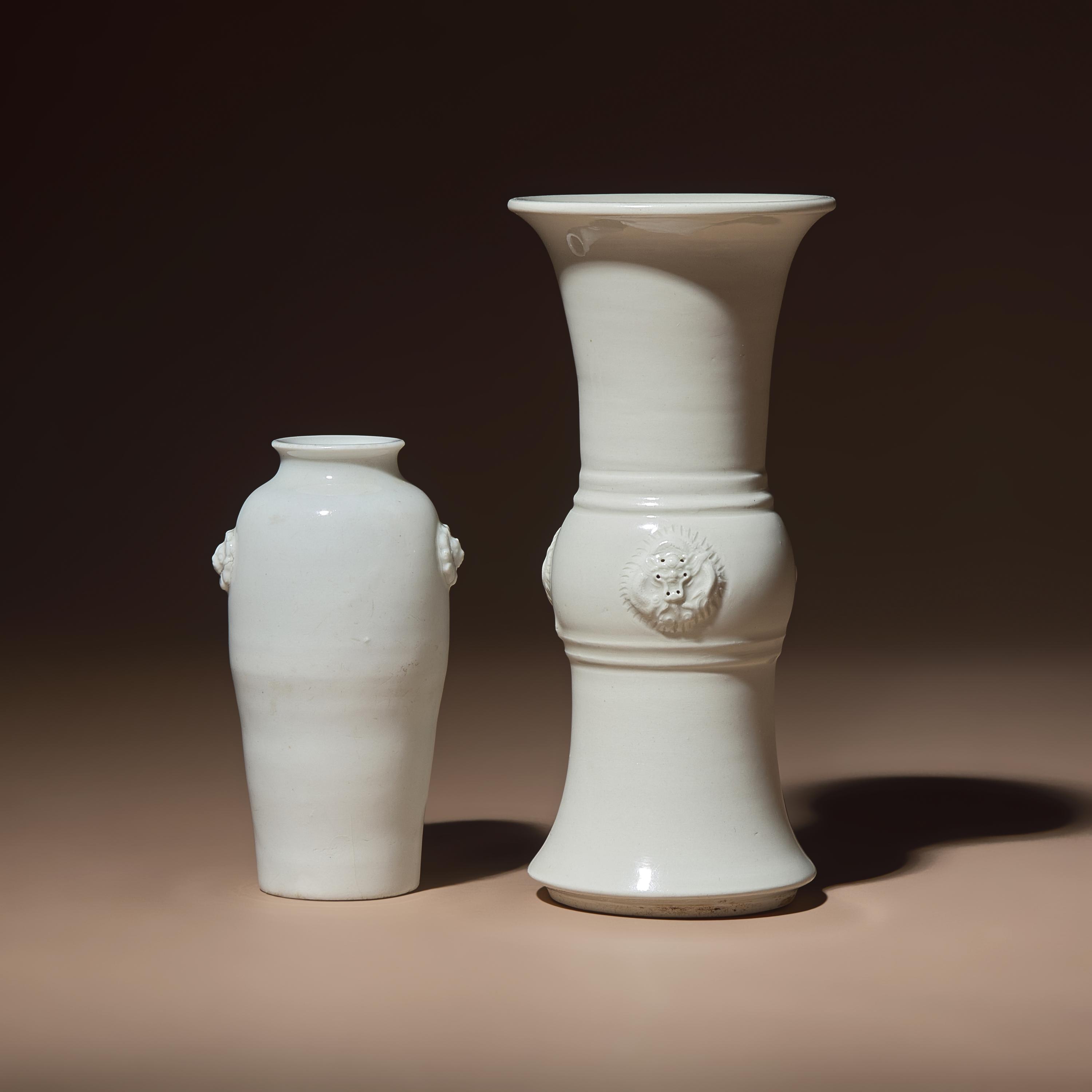 Two Chinese Blanc-de-Chine Porcelain Vases, 17th-18th Century — 清中期 德化白瓷雙輔首耳筒瓶及花觚