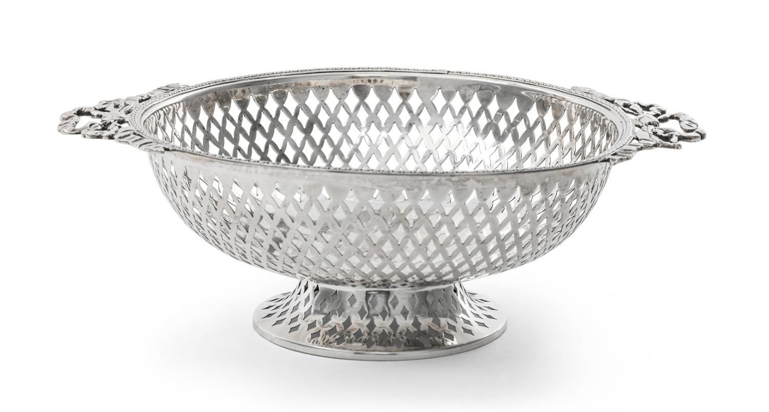An Edwardian Silver Small Basket, Goldsmiths & Silversmiths Co. Ltd., London, 1908, circular, with pierced sides and applied ribbon han