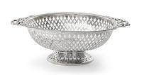 An Edwardian Silver Small Basket, Goldsmiths & Silversmiths Co. Ltd., London, 1908, circular, with pierced sides and applied ribbon han
