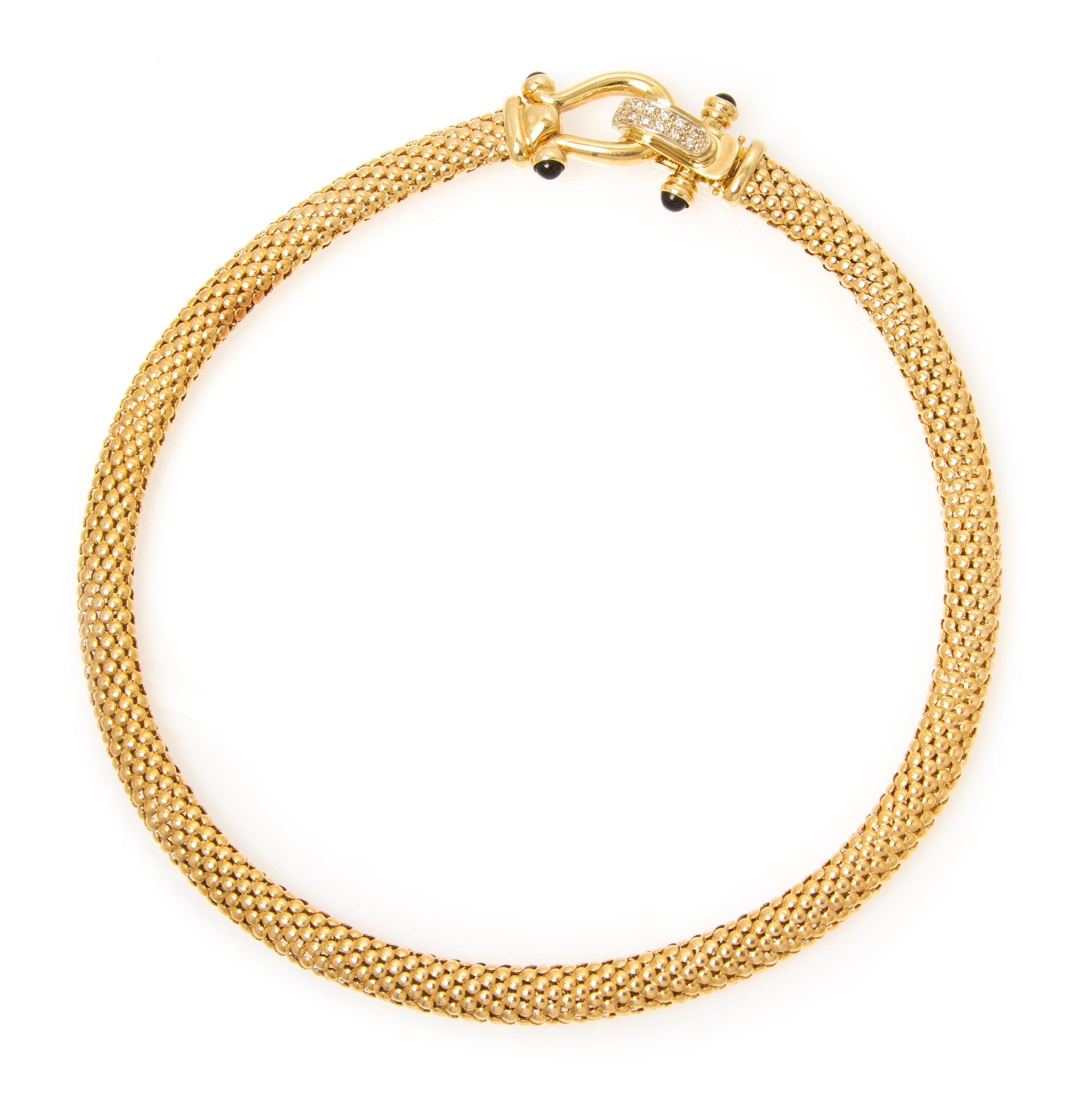 A 14 Karat Yellow Gold, Diamond and Onyx Necklace, 28.15 dwts.
