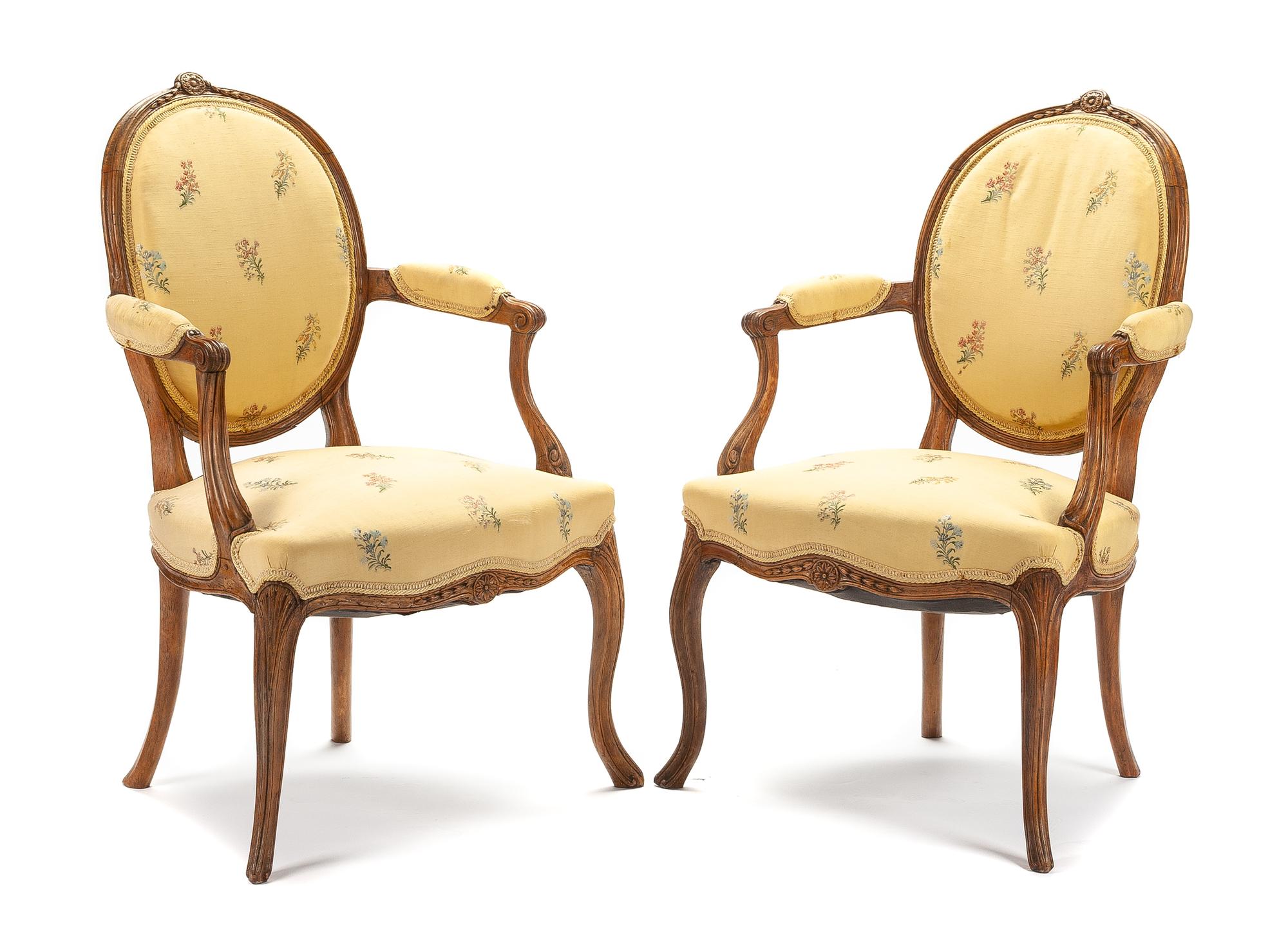 A Pair of George III Walnut Armchairs Height 35 inches. — LATE 18TH CENTURY