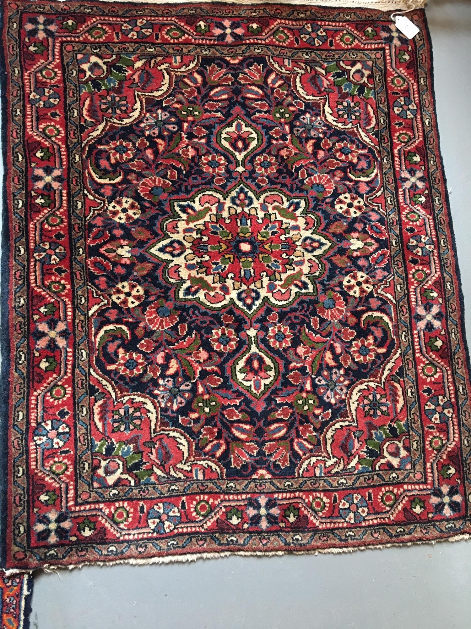 Two Persian Wool Mats Larger, 38 x 26 inches.