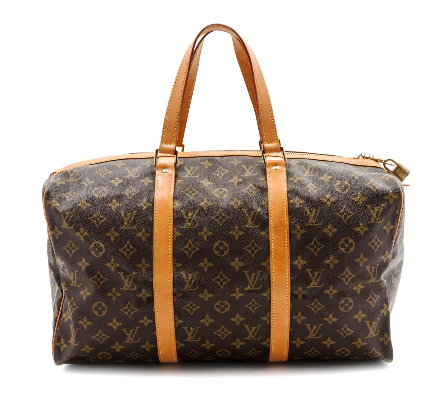 A Louis Vuitton Monogram Canvas Keepall 45 Bag and Garment Bag, 18 x 9 x 8 inches.