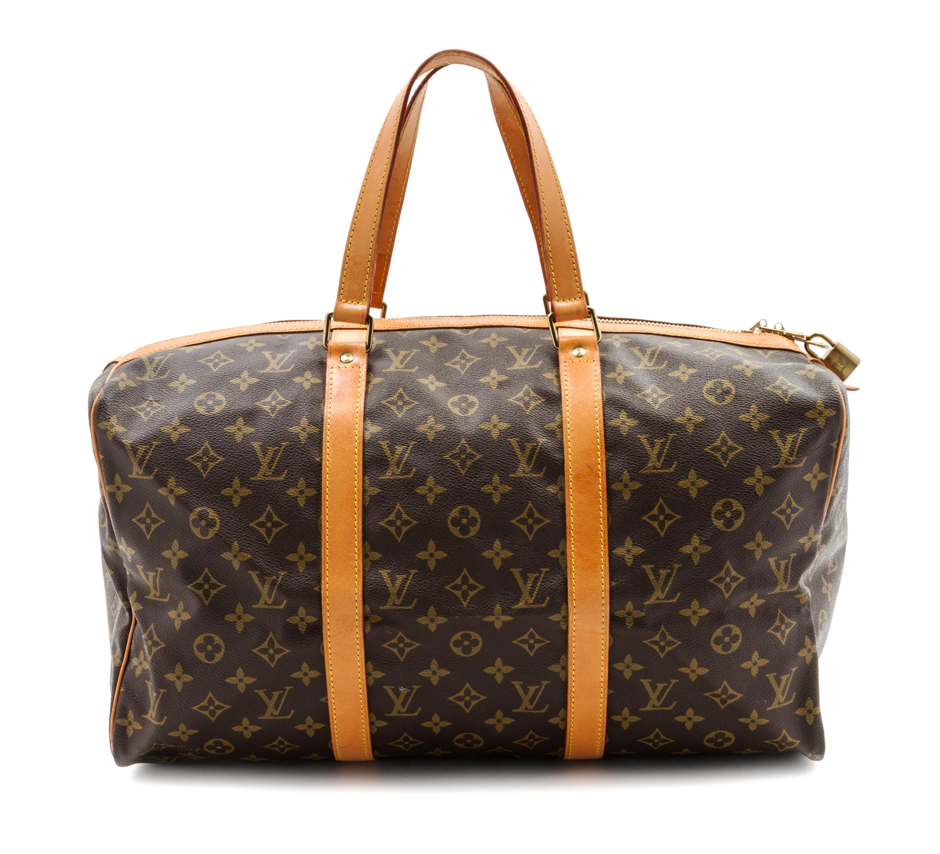 A Louis Vuitton Monogram Canvas Keepall 45 Bag and Garment Bag, 18 x 9 x 8 inches.