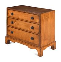A Contemporary Carved Walnut Chest of Drawers