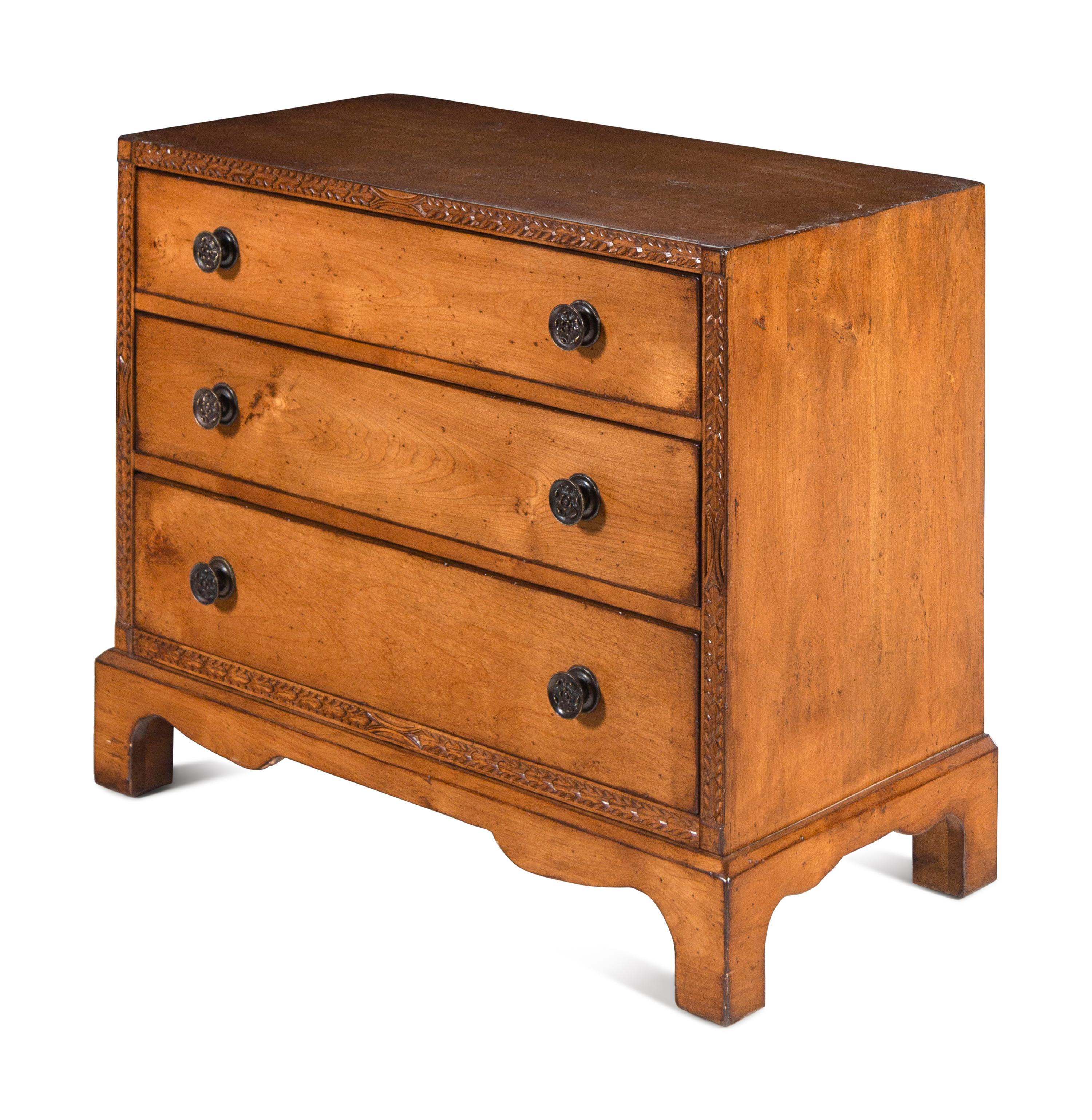 A Contemporary Carved Walnut Chest of Drawers