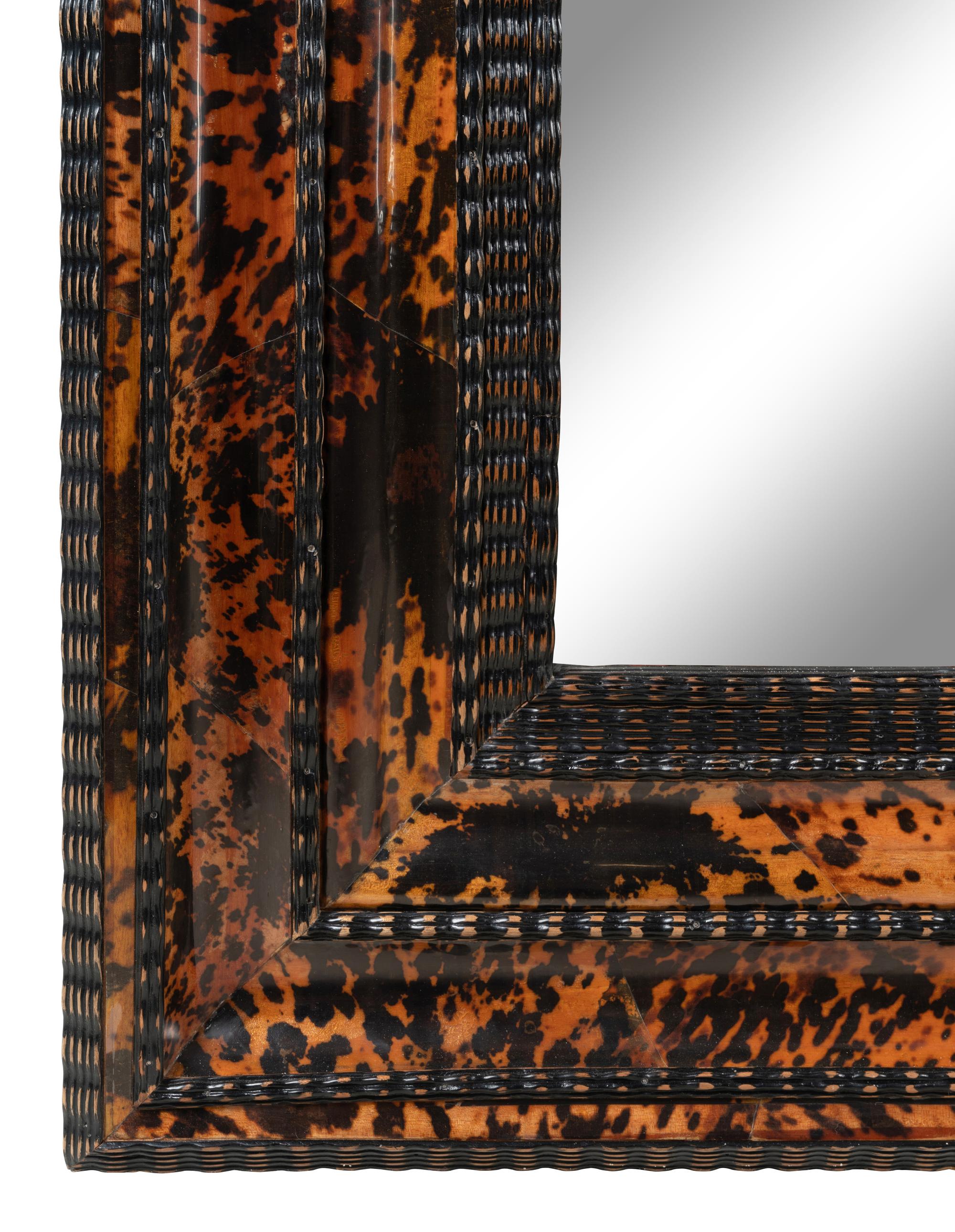 A Flemish Ripple-Molded and Faux Tortoiseshell Veneered Mirror