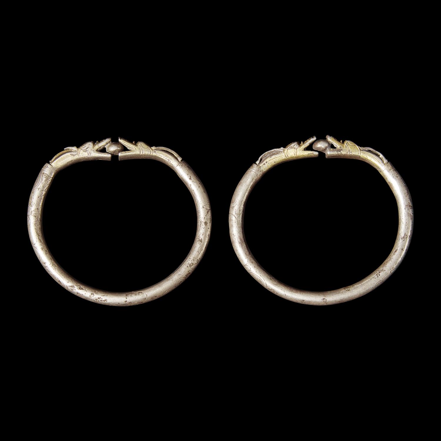 Six Chinese Silver 'Dragon' Bracelets, Qing Dynasty 清 銀龍頭紋鐲六隻