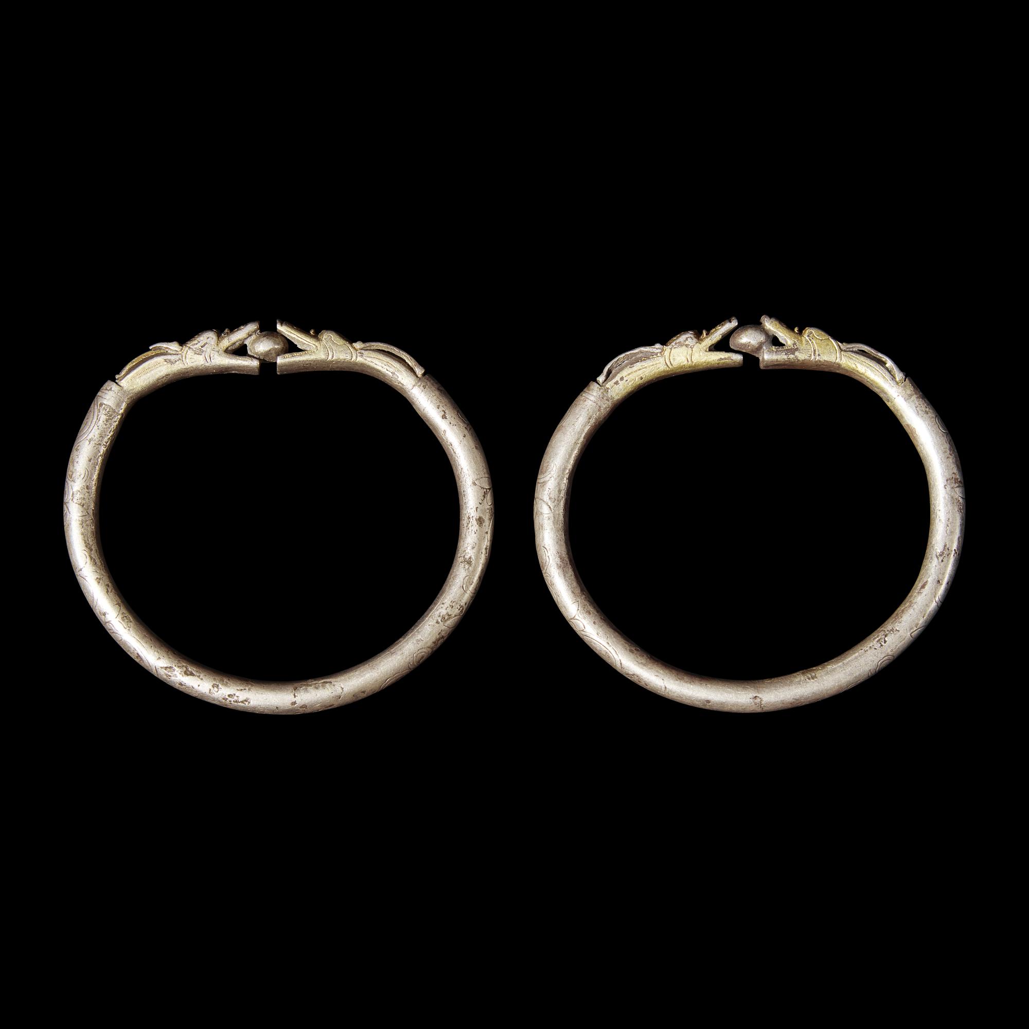 Six Chinese Silver 'Dragon' Bracelets, Qing Dynasty 清 銀龍頭紋鐲六隻