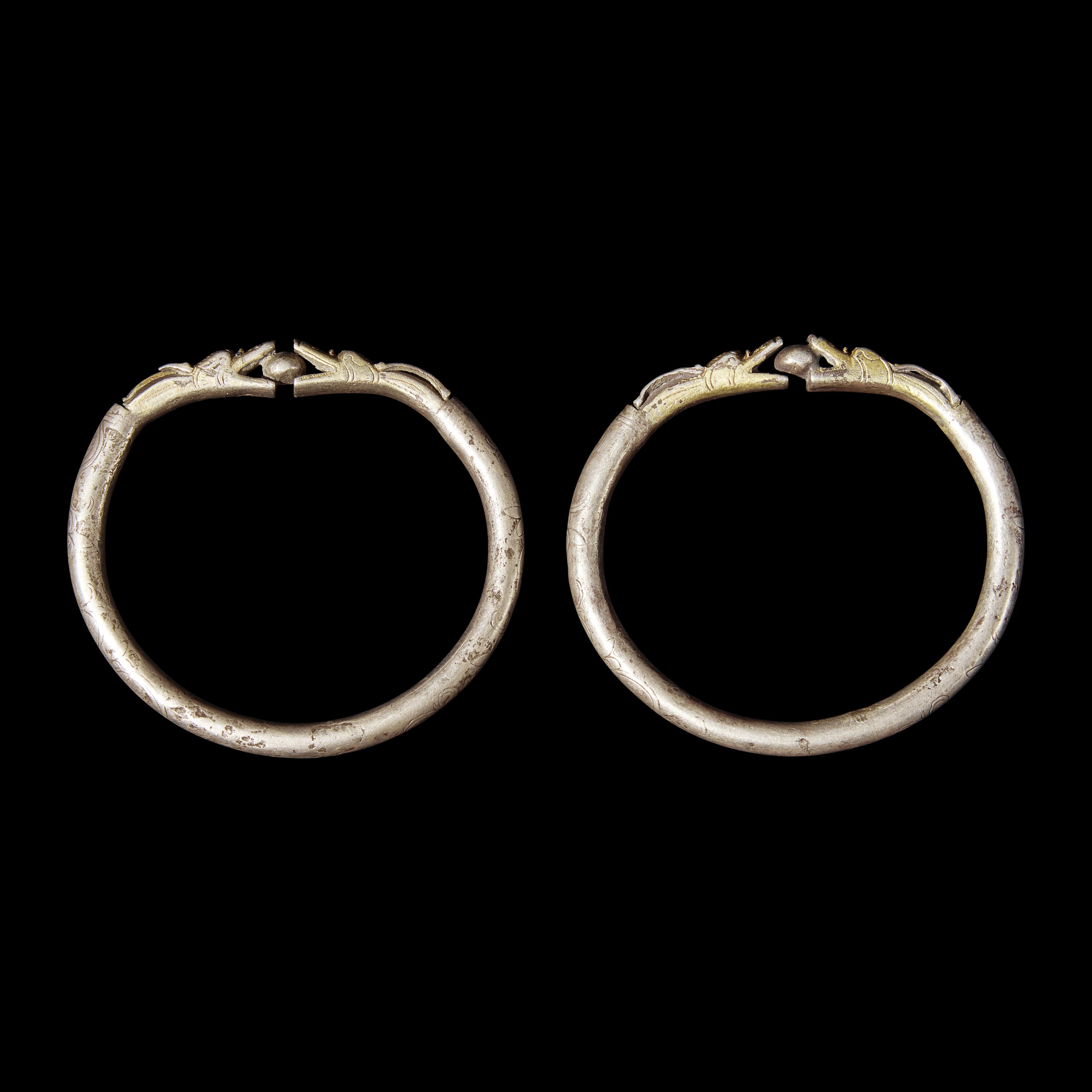 Six Chinese Silver 'Dragon' Bracelets, Qing Dynasty 清 銀龍頭紋鐲六隻