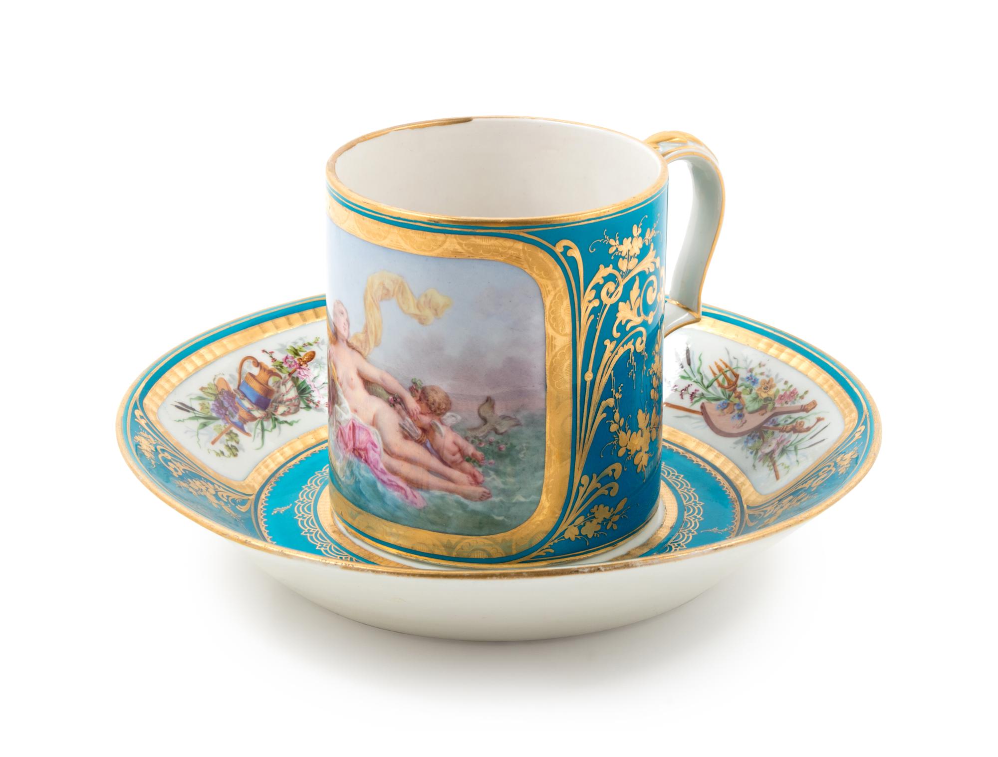 A Sèvres Painted, Parcel Gilt and Celeste Blue-Ground Porcelain Cup and Saucer