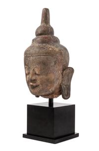 A Thai Stone Head of Buddha Height overall 26 1/2 inches.