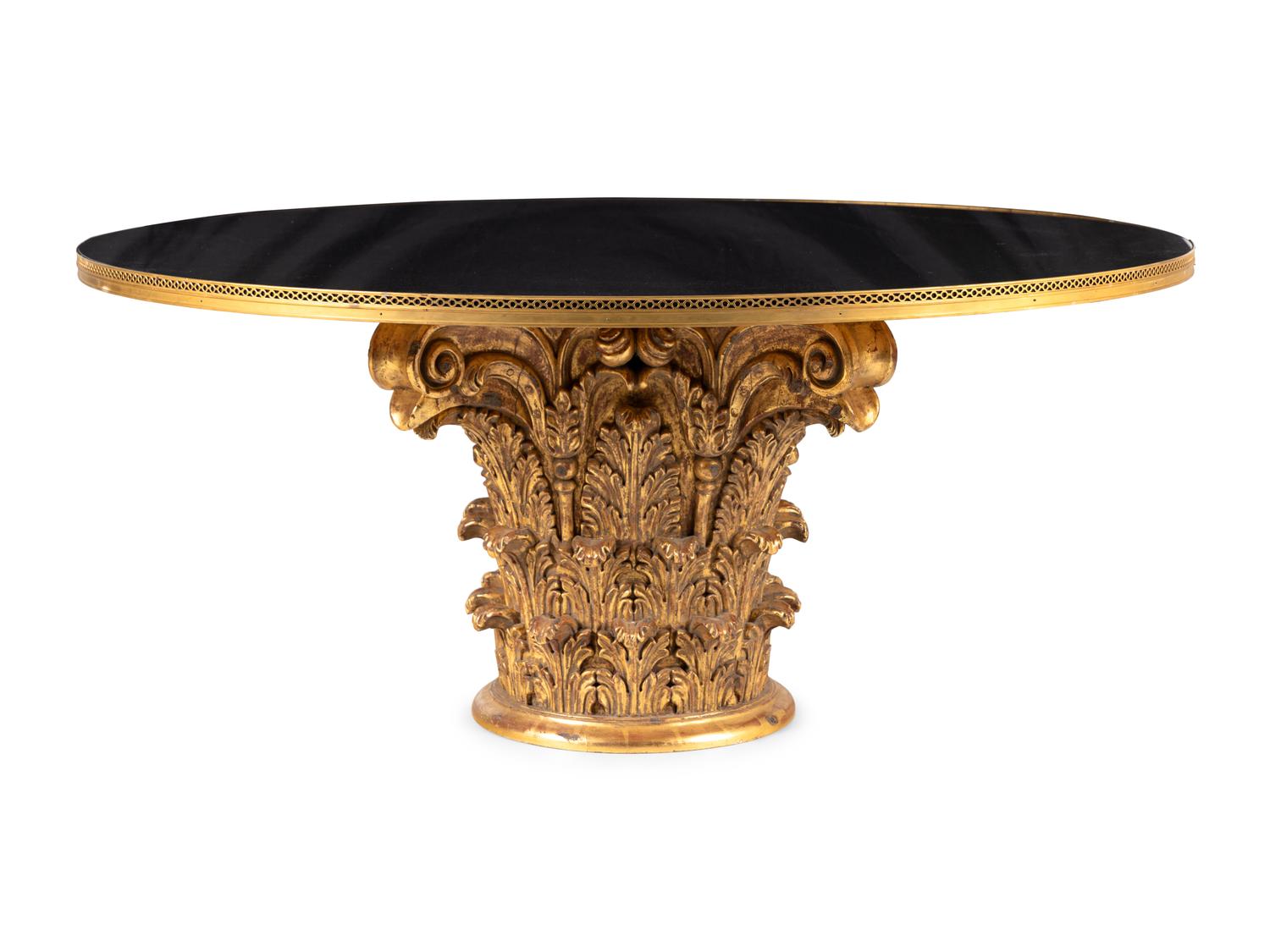 A Regency Style Brass Mounted Black Granite and Giltwood Center Table