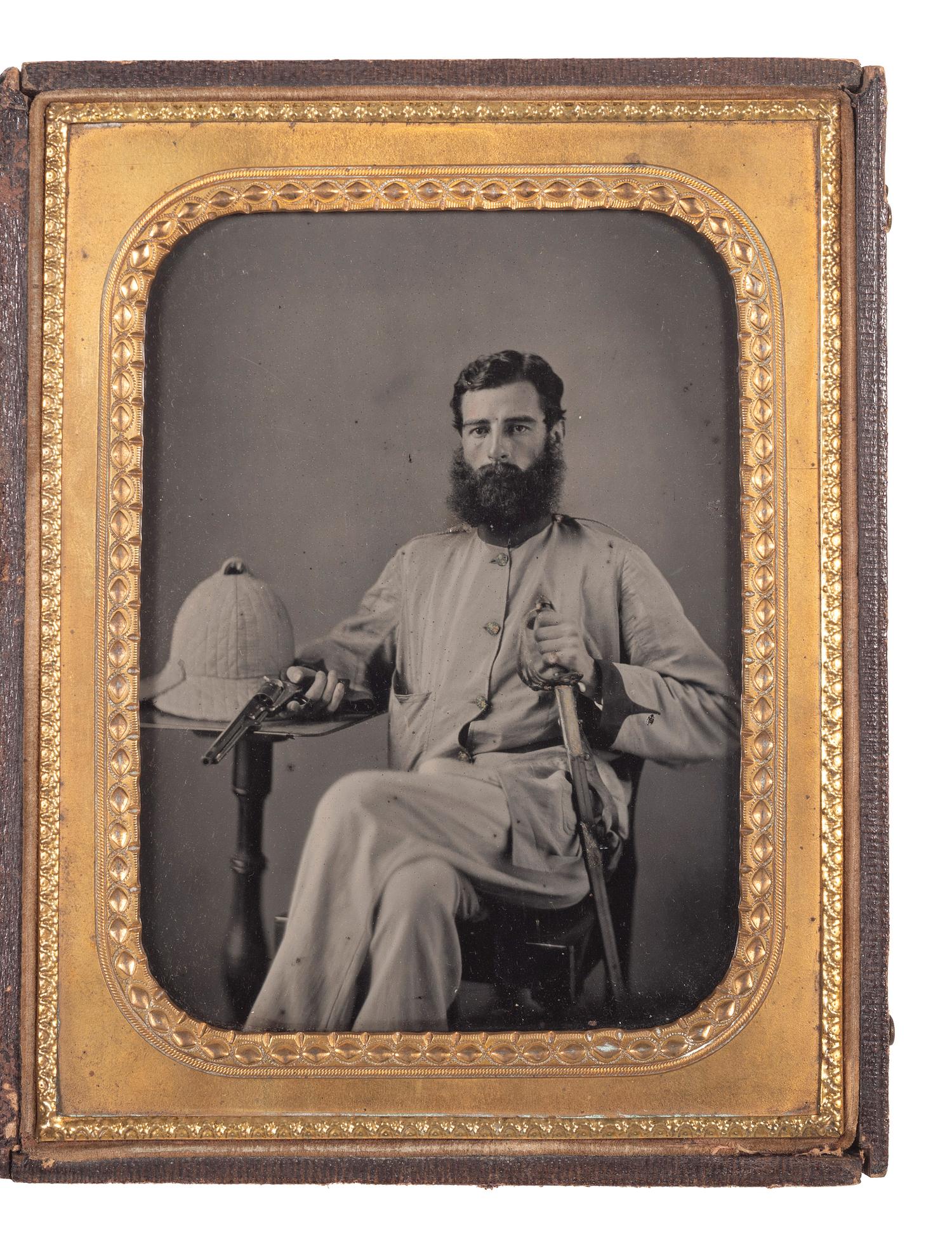 [EARLY PHOTOGRAPHY] -- [MILITARIA]. Half plate ambrotype of a double-armed British soldier with companion CDV. Ca 1857-1858.