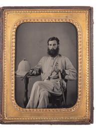 [EARLY PHOTOGRAPHY] -- [MILITARIA]. Half plate ambrotype of a double-armed British soldier with companion CDV. Ca 1857-1858.