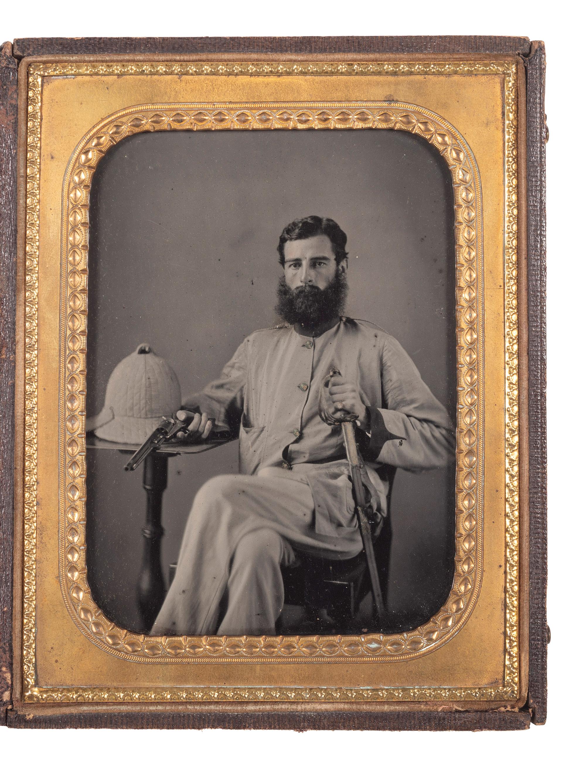 [EARLY PHOTOGRAPHY] -- [MILITARIA]. Half plate ambrotype of a double-armed British soldier with companion CDV. Ca 1857-1858.