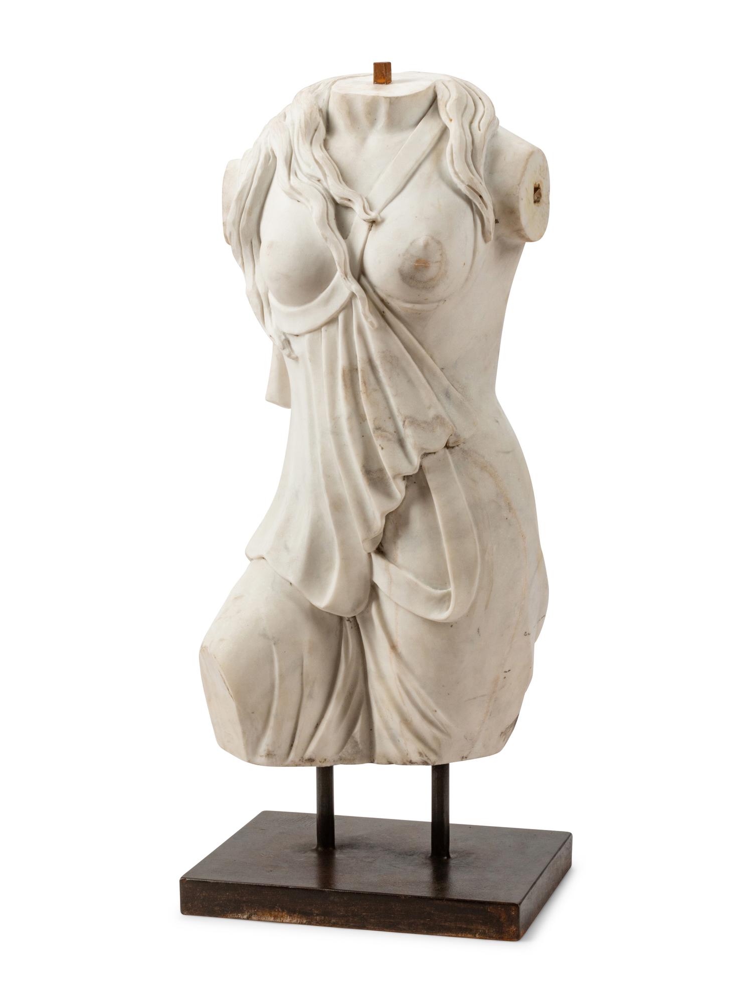 An Italian Carved White Marble Female Torso on an Iron Base