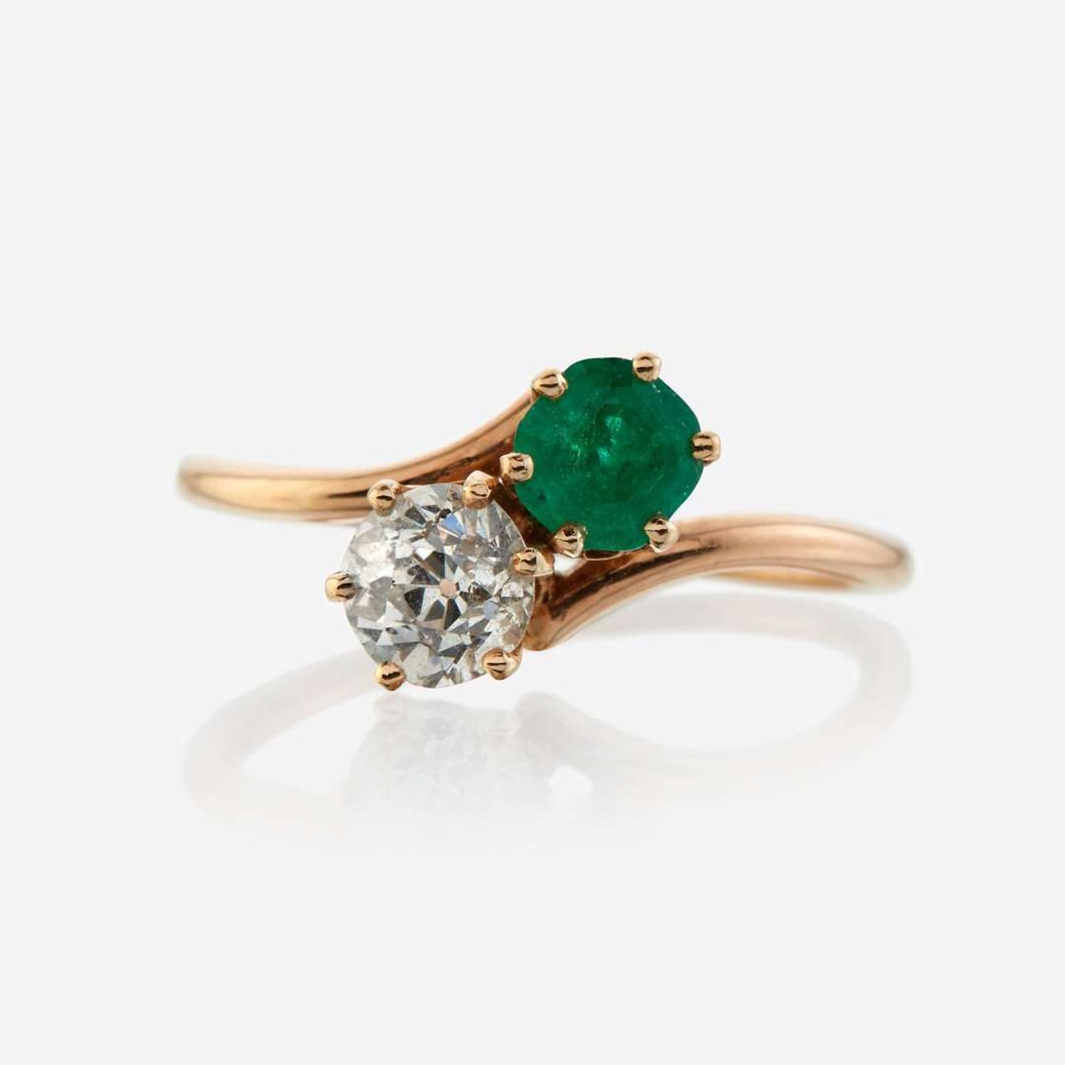 A diamond, emerald, and gold ring