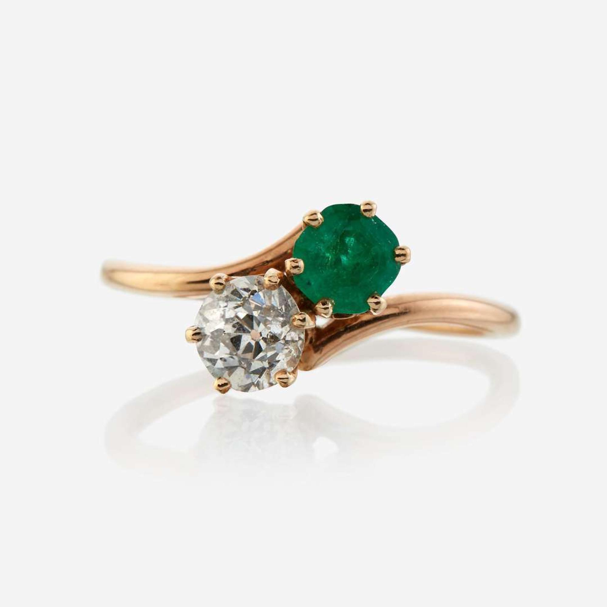 A diamond, emerald, and gold ring