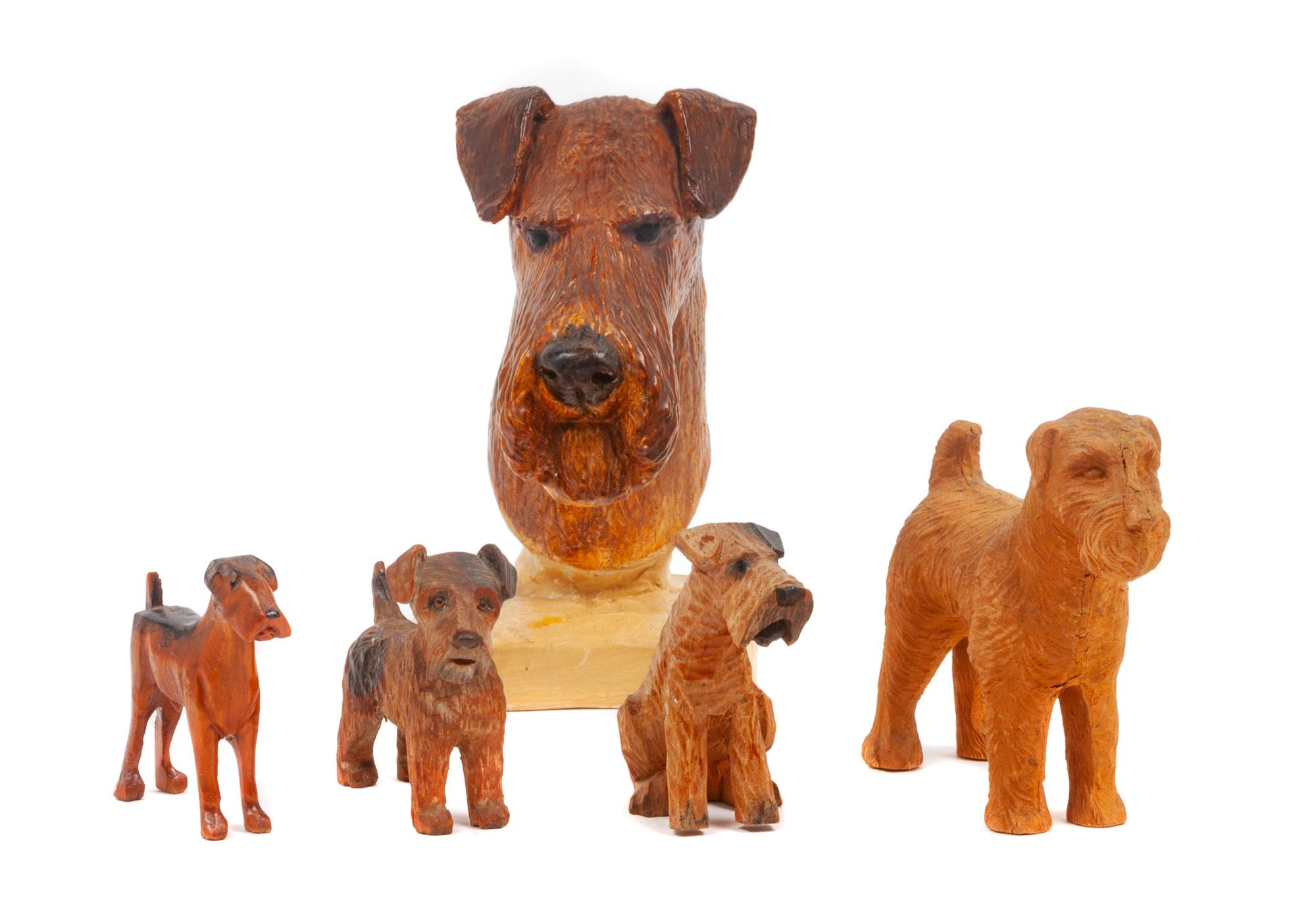 A Group of Five Airedale Terrier Figures Height of tallest 5 3/4 inches.