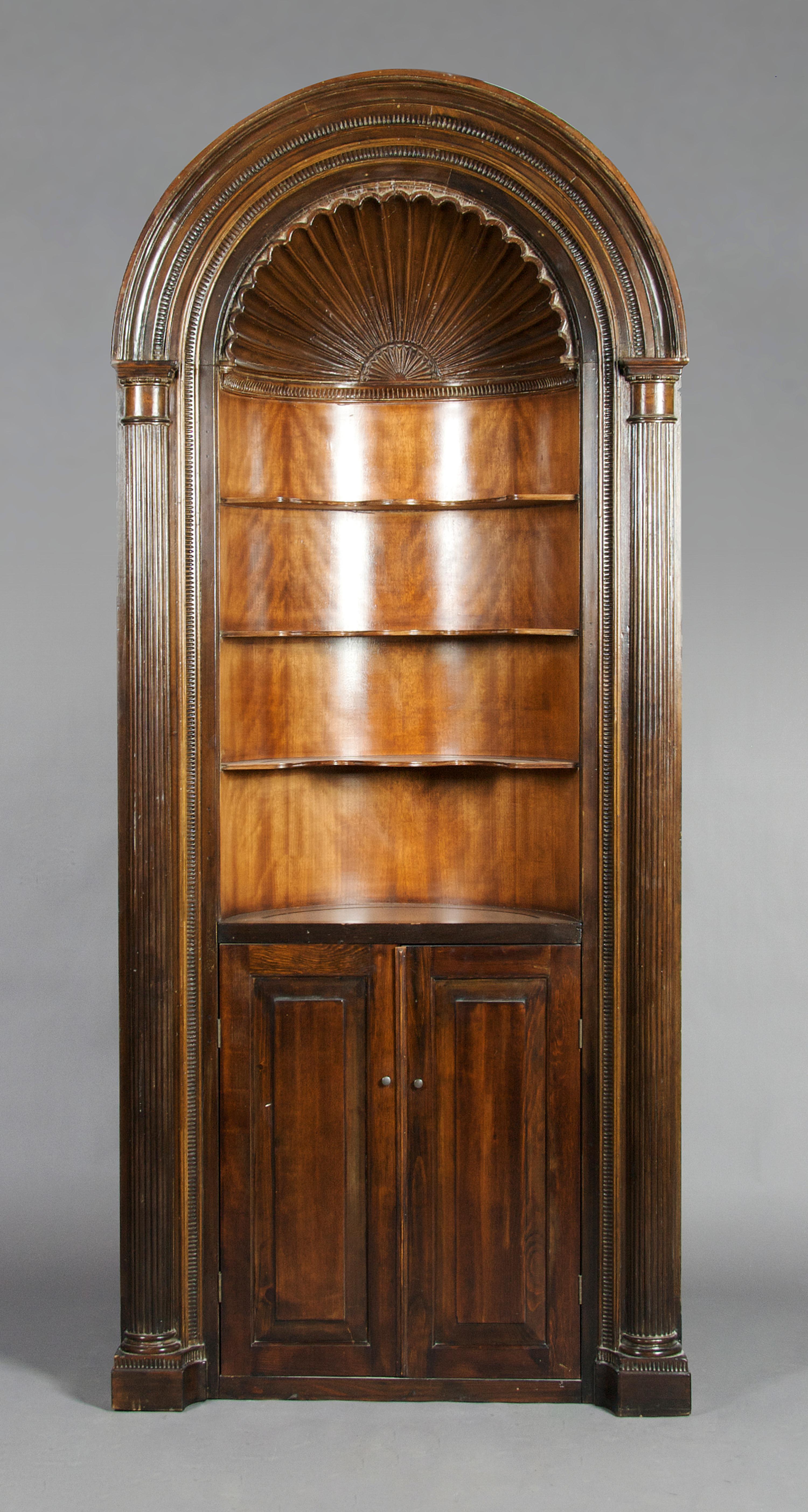 An English Neoclassical Corner Cupboard, Height 93 3/4 x width 40 1/2 inches.