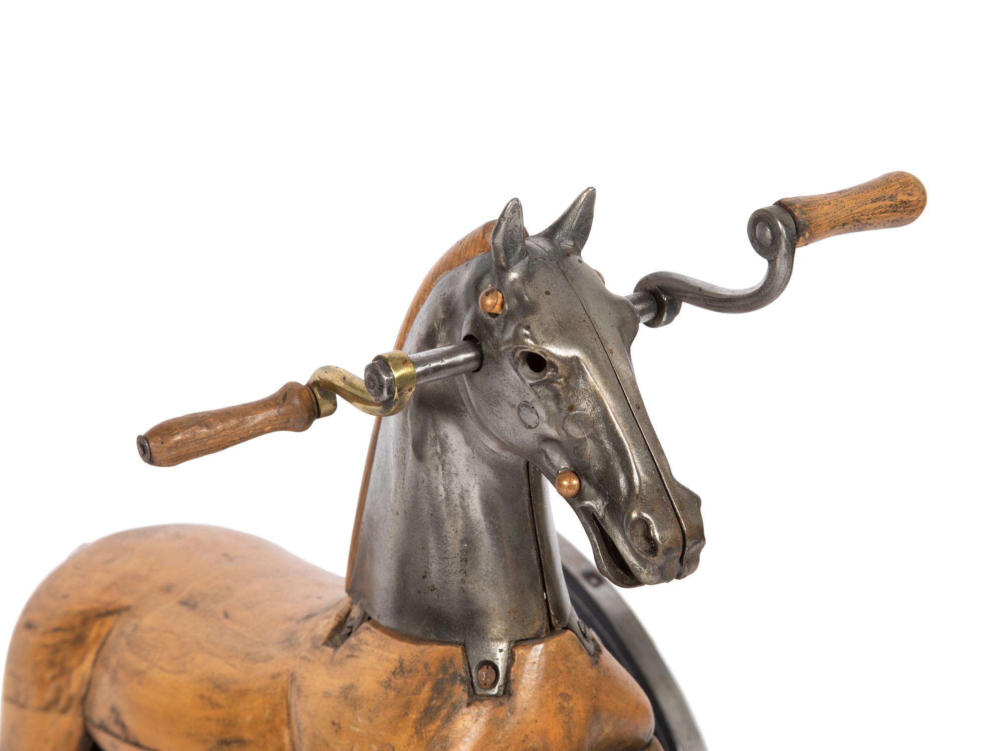 A Carved Wood and Cast Metal Tricycle
